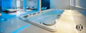 Why are swim spas perfect for hotels and health clubs to install?