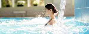 How can hot tubs alleviate muscle pain?