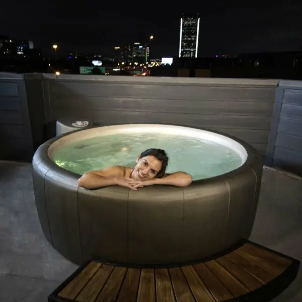 legend soft tub outside above ground with city night views