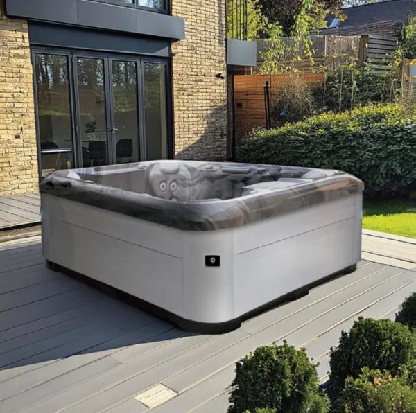 aquasolus cove hot tub on decking in garden