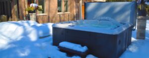 How do specially-designed covers help to protect your hot tub?