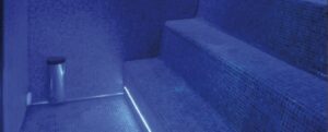 How does the history of the steam room benefit modern users?
