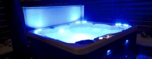 How can using a hot tub help you in the winter months?