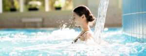 How can hot tubs alleviate muscle pain?