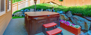 Why is it important to use and protect your hot tub cover?