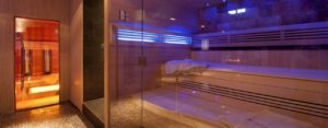 What are the health benefits of sitting in a sauna?