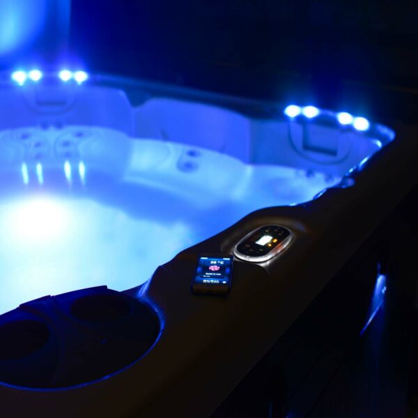 hydropool 4300 serenity hot tub with blue lighting