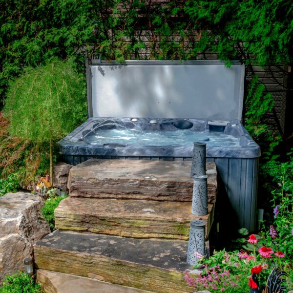 hydropool 4300 serenity hot tub set in a garden