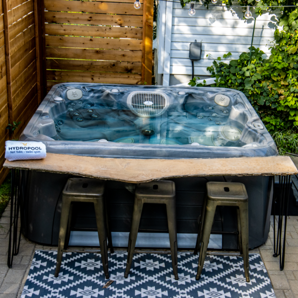 Hydropool Serenity 6800 hot tub with bar stools alongside