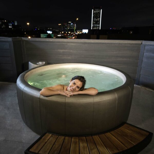 legend soft tub outside above ground with city night views