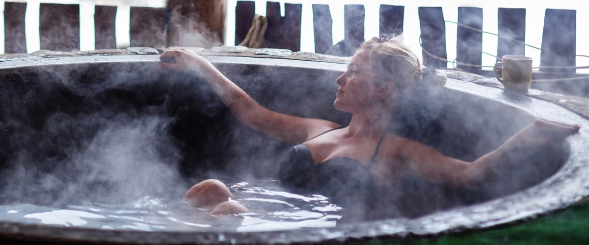 Women in warm hot tub during the winter